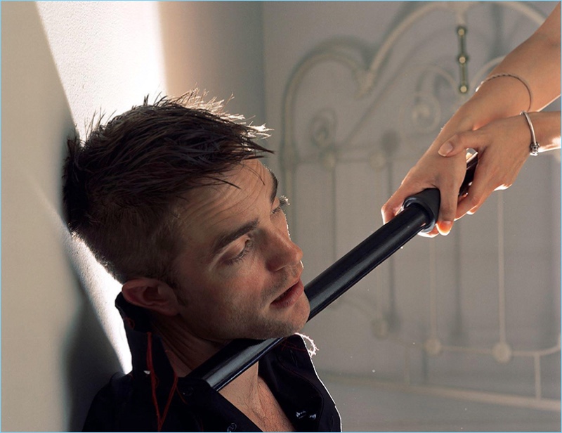 Torbjorn Rodland photographs Robert Pattinson in a Dior Homme black shirt with red details.