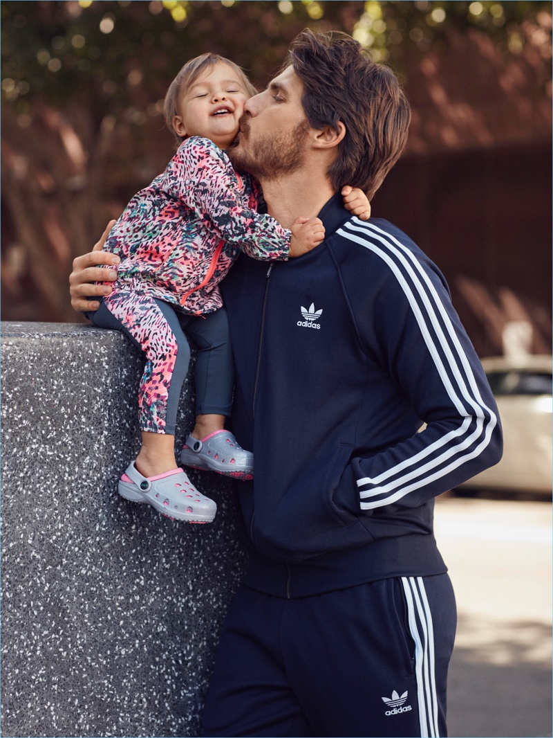 Model Ryan Burns sports an Adidas tracksuit for Lord & Taylor's 2017 Father's Day campaign.
