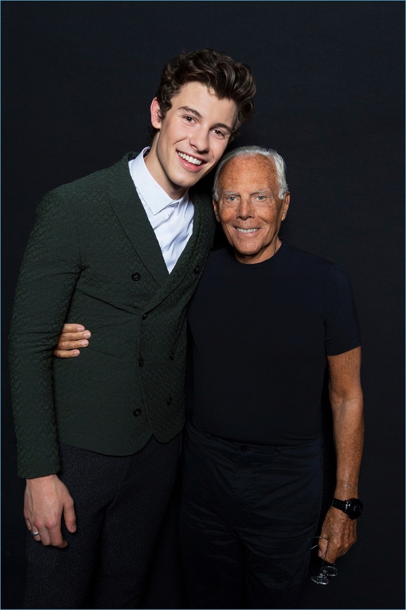 Singer Shawn Mendes poses for pictures with designer Giorgio Armani.