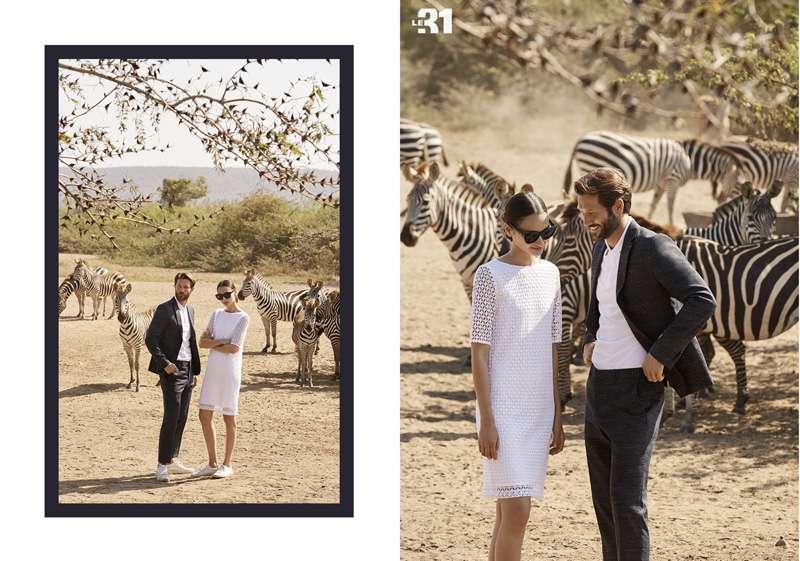 Posing with Zebras, John Halls and Bruna Tenório model the latest from Simons. John wears a LE 31 chambray suit with a Fred Perry polo.