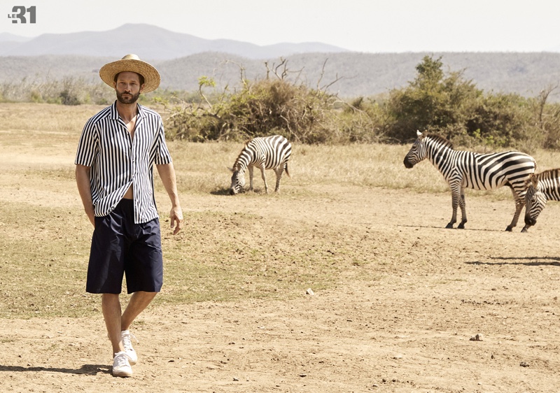 Embracing stripes, John Halls wears a LE 31 two-tone shirt and straw hat with Bermuda shorts.