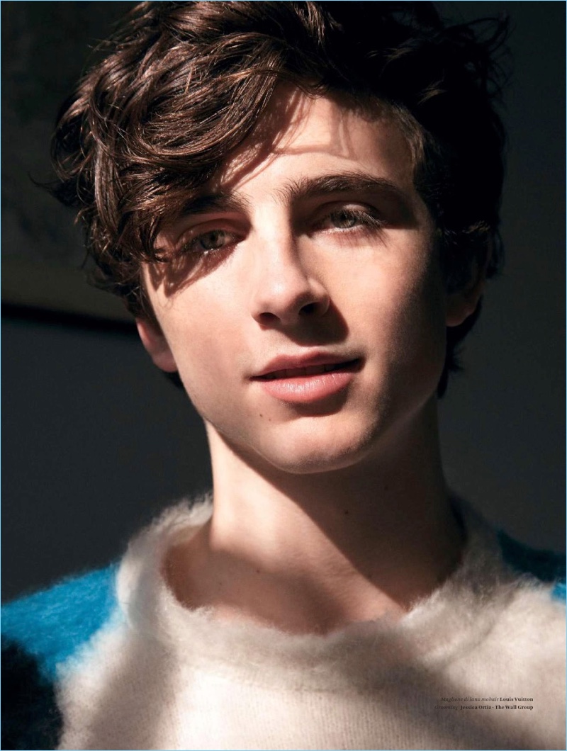 Front and center, Timothée Chalamet wears a statement sweater by Louis Vuitton.