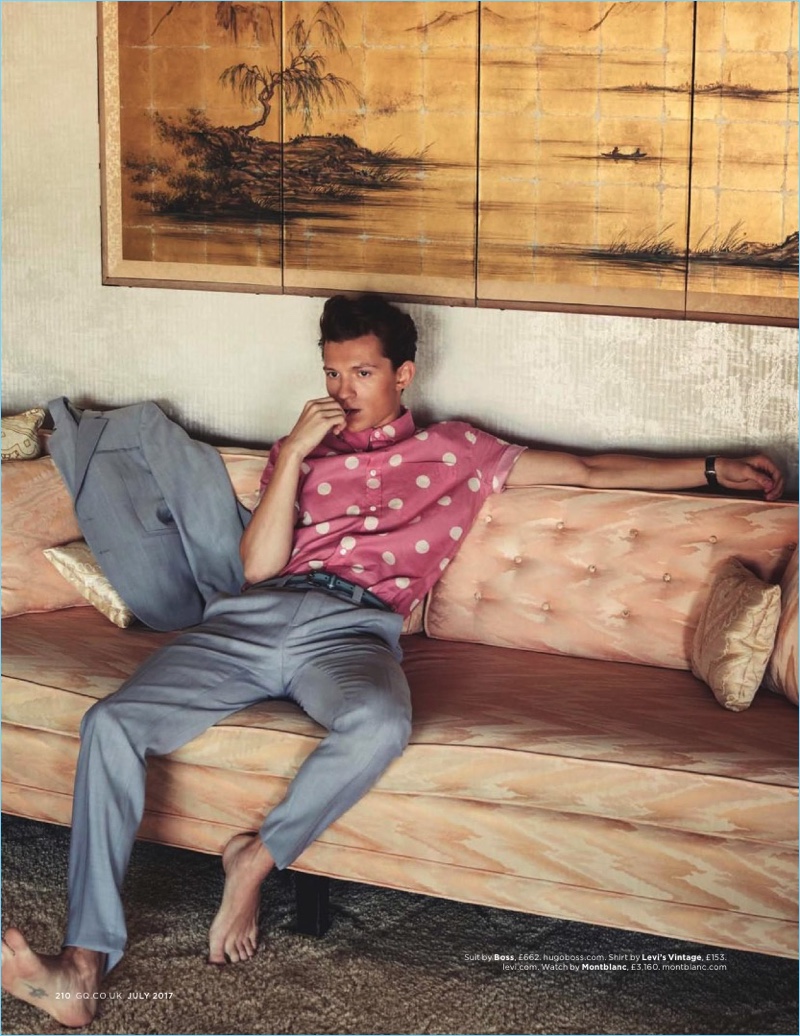 Actor Tom Holland wears a BOSS by Hugo Boss suit with a polka dot print Levi's Vintage shirt.