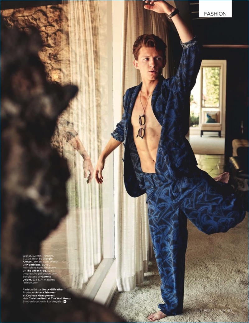 Busting a move, Tom Holland wears a Giorgio Armani jacket and trousers. » King of Swing: Tom Holland Relaxes Poolside with British GQ Busting a move, Tom Holland wears a Giorgio Armani jacket and trousers.