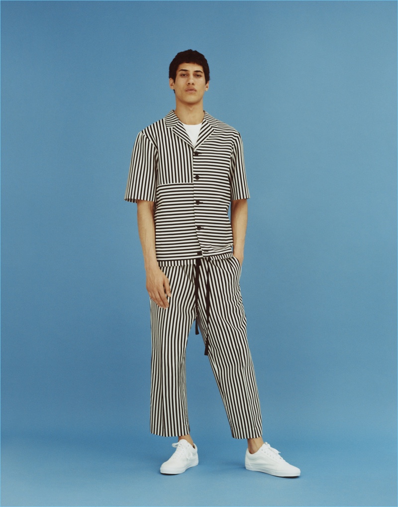 Malik Al Jerrari wears a striped number from Topman's fall-winter 2017 collection.