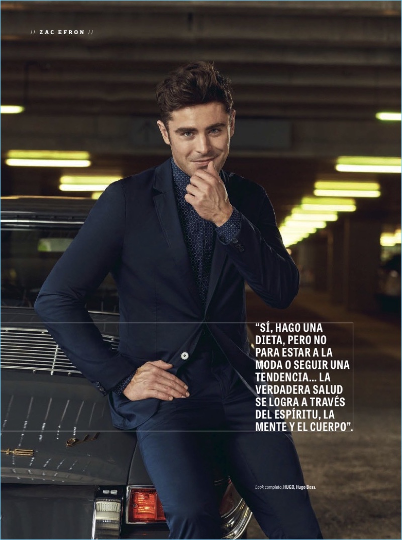 All smiles, Zac Efron dons a suit and printed shirt from HUGO Hugo Boss.