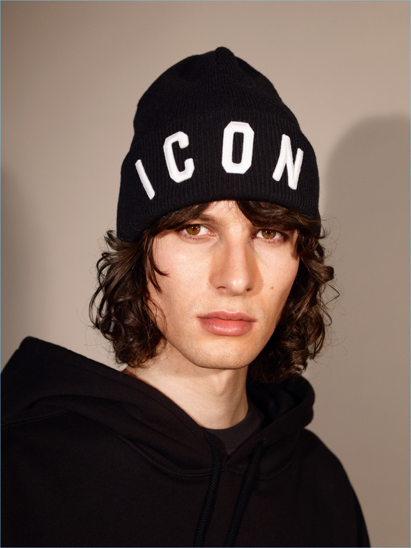 Ákos Sógor wears a Dsquared2 beanie with a Stella McCartney pullover.