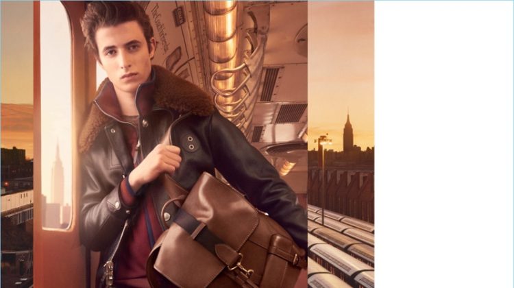 Oscar Kindelan takes hold of Coach's brown leather Bleeker backpack $698 for the brand's fall-winter 2017 campaign.