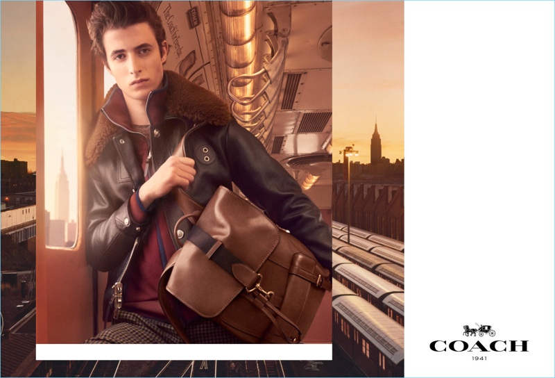 Oscar Kindelan takes hold of Coach's brown leather Bleeker backpack $698 for the brand's fall-winter 2017 campaign.