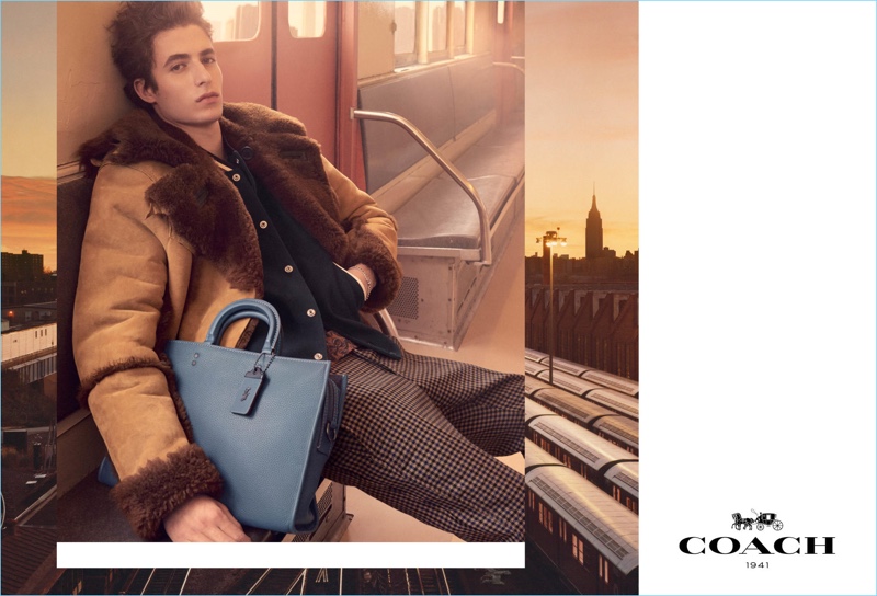 Steven Meisel photographs Oscar Kindelan with Coach's Rogue Brief $695 for the label's fall-winter 2017 campaign.