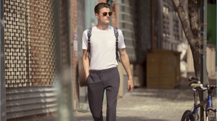 White T-Shirt: Going on a stroll, Eli Hall wears a Sunspel pocket tee $54 with Club Monaco pull on trousers $169 and Rag & Bone sneakers $227.50. Eli's casual look is complete with Ray-Ban sunglasses $160 and a Tumi backpack $345.