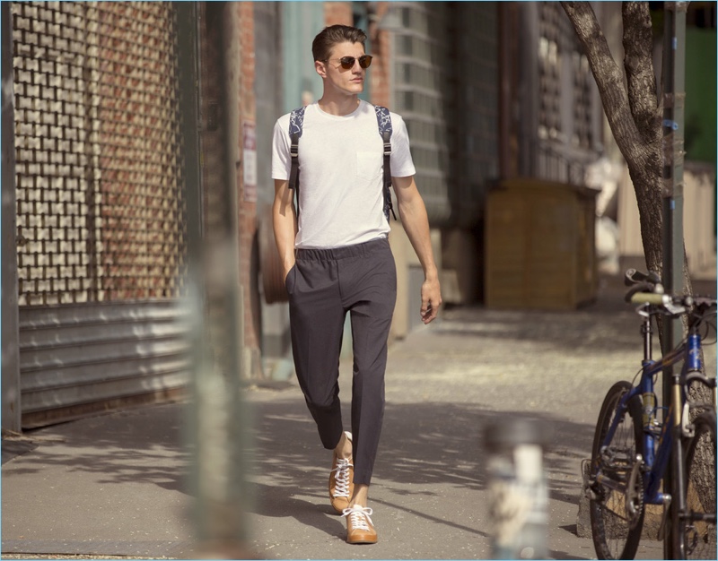 White T-Shirt: Going on a stroll, Eli Hall wears a Sunspel pocket tee $54 with Club Monaco pull on trousers $169 and Rag & Bone sneakers $227.50. Eli's casual look is complete with Ray-Ban sunglasses $160 and a Tumi backpack $345.