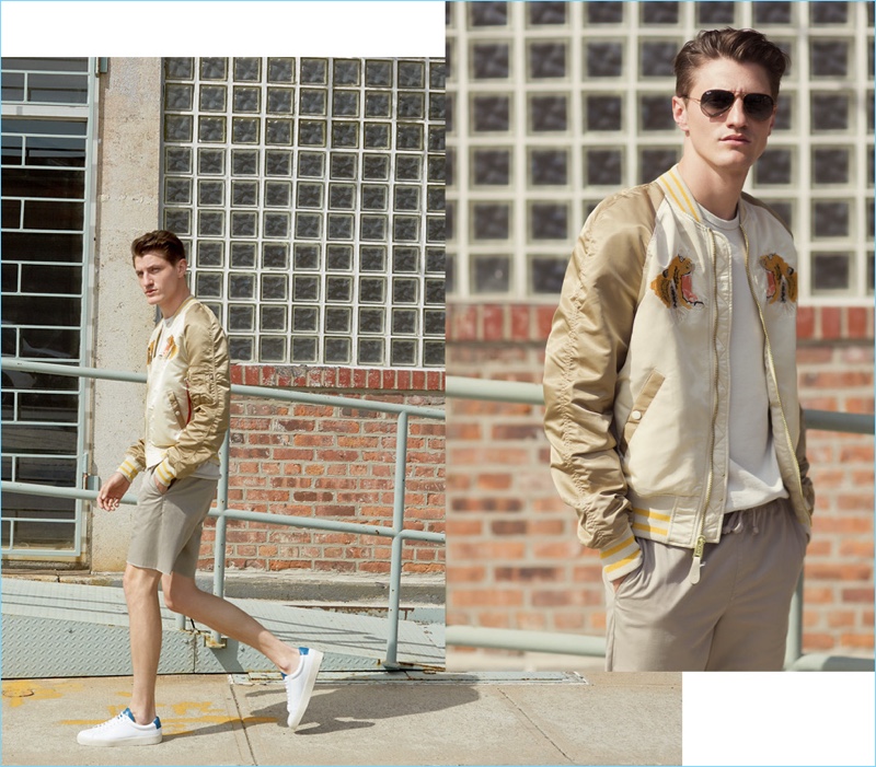 Khaki Shorts: Model Eli Hall sports an Alpha Industries tiger souvenir jacket $225 with Theory shorts $165. Eli also rocks a Reigning Champ tee $90 and George Brown BILT sneakers $295.