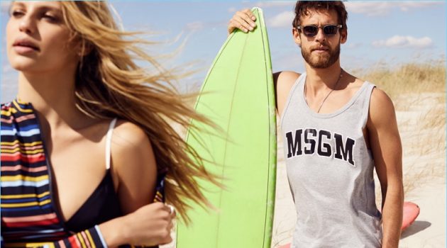 Surf's Up: East Dane Spotlights Timely Beach Style Summer's in session with a MSGM logo tank $58.50, Billy Reid swim shorts $125, Miansai watch $495, and Steven Alan sunglasses $165.