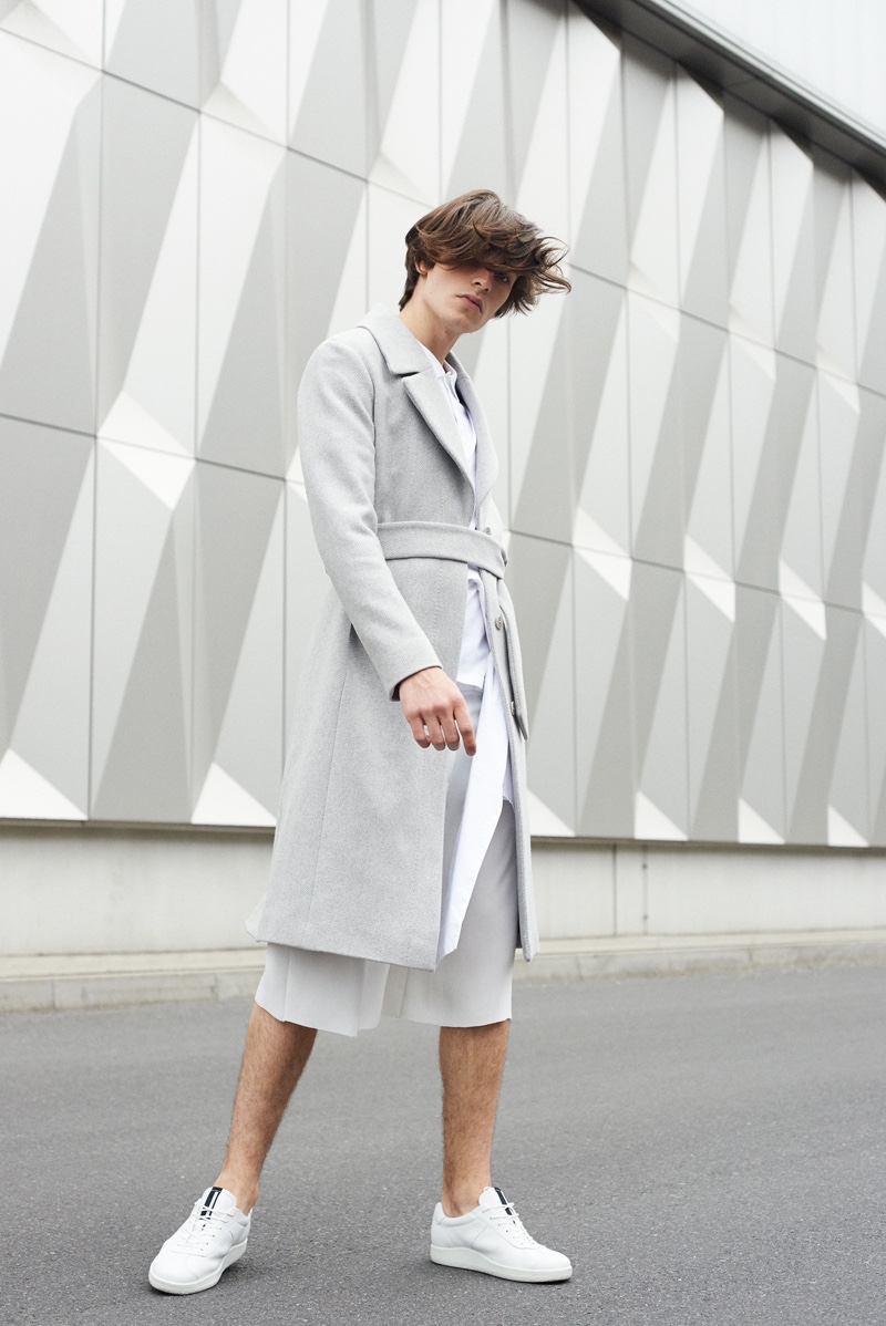 Leon wears coat St. Emile, shirt Vero Moda, pants Vladimir Karaleev, and shoes ECCO.