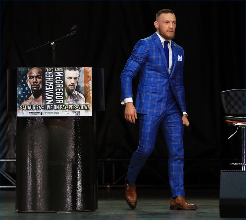 Conor McGregor's visit to Toronto calls for a brilliant blue window plaid suit by David August.