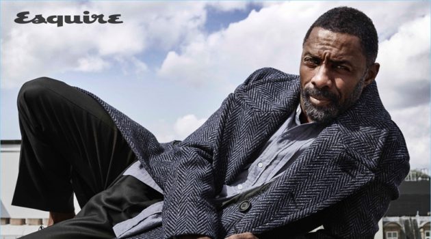 Ready for fall, Idris Elba wears a herringbone coat and smart pieces by Burberry.