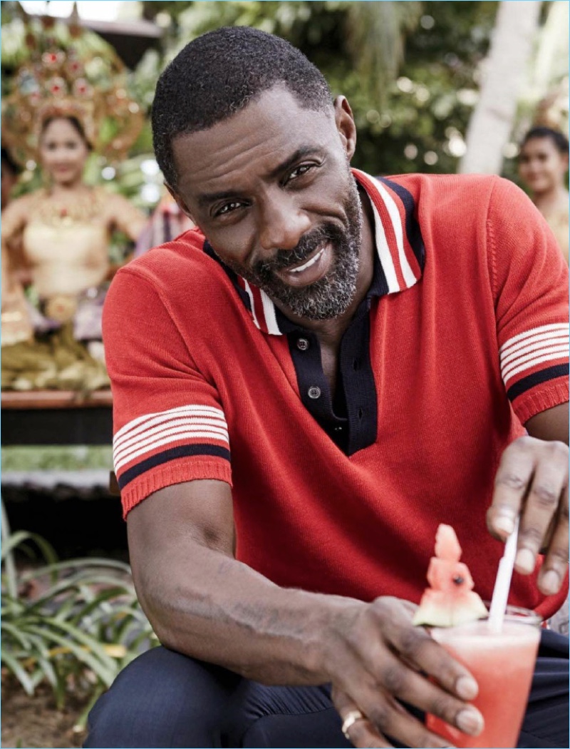 Actor Idris Elba charms in a red knit polo for the pages of Essence magazine.