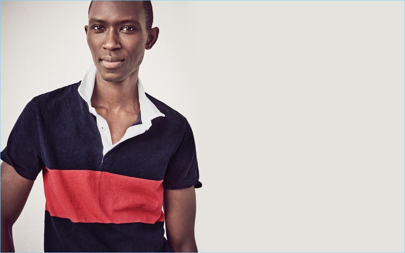 Rugby Polo: Armando Cabral embraces preppy style with a J.Crew short-sleeve rugby polo $49.50 in navy and red.