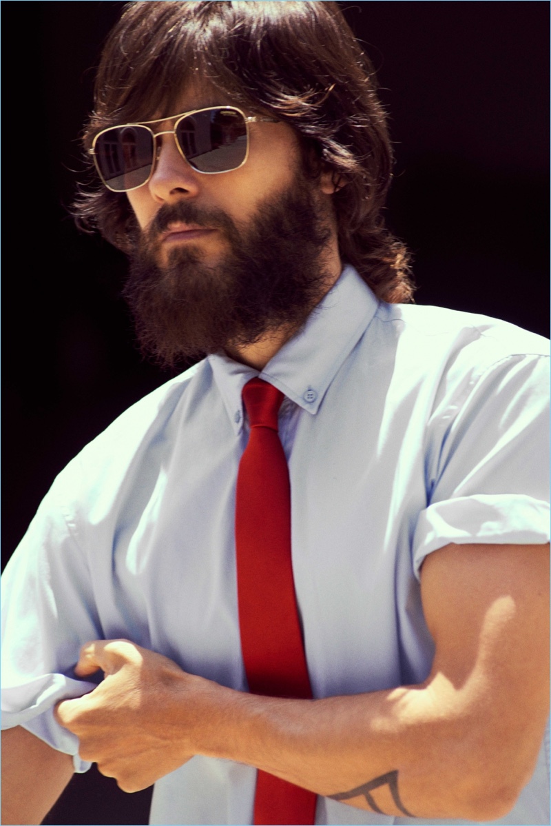 Rolling up the sleeves of a Balenciaga shirt, Jared Leto also wears the label's tie and Carrera sunglasses.