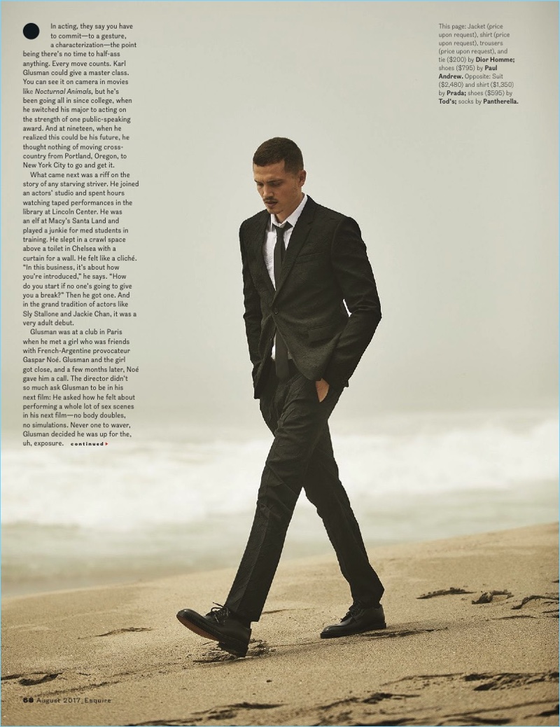 Walking the beach, Karl Glusman wears a Dior Homme suit.
