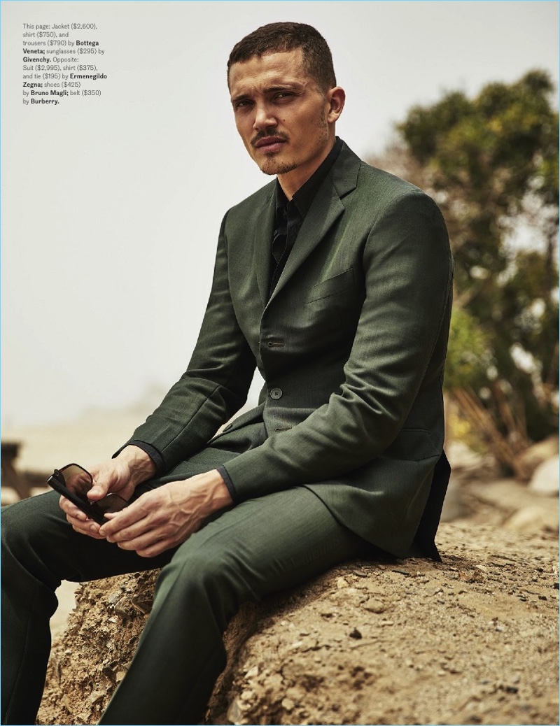 Making a case for dark green, Karl Glusman dons a shirt and suit by Bottega Veneta.