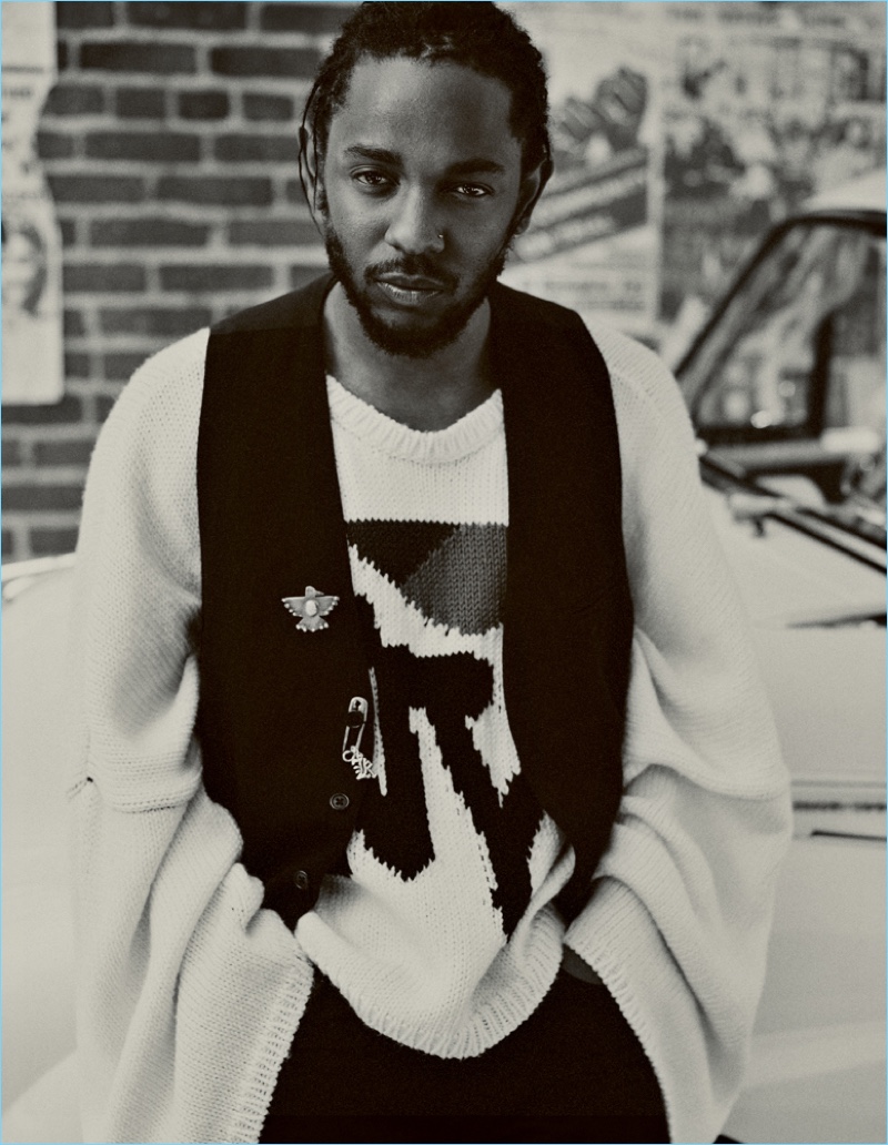 Front and center, Kendrick Lamar wears an Ann Demeulemeester vest with a Raf Simons sweater and Simon Miller jeans.