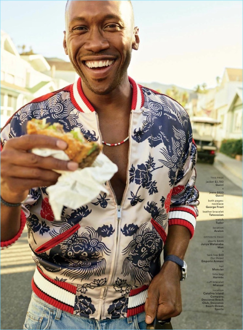 Grabbing a bite to eat, Mahershala Ali wears a tropical print bomber jacket and denim jeans by Gucci.