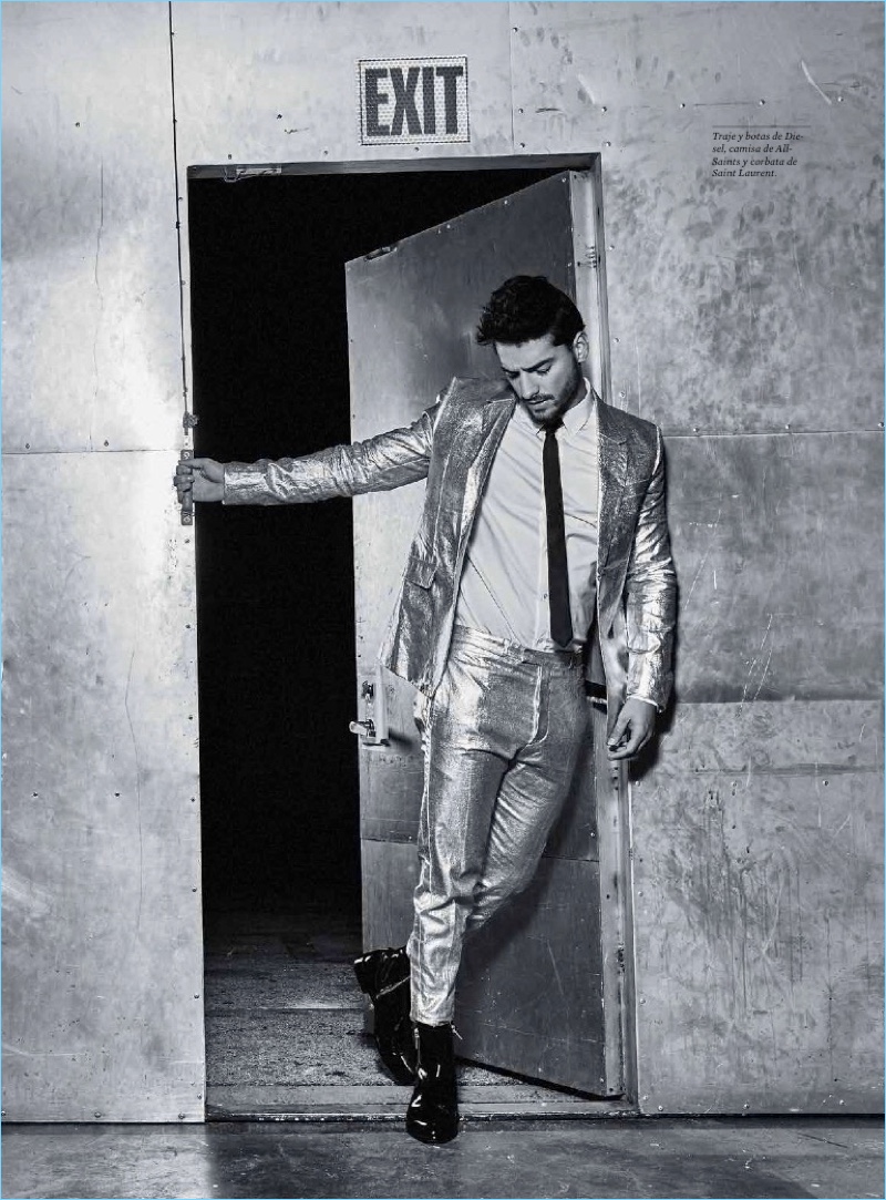 Making a statement, Maluma wears a metallic suit by Diesel with an AllSaints shirt and Saint Laurent boots.