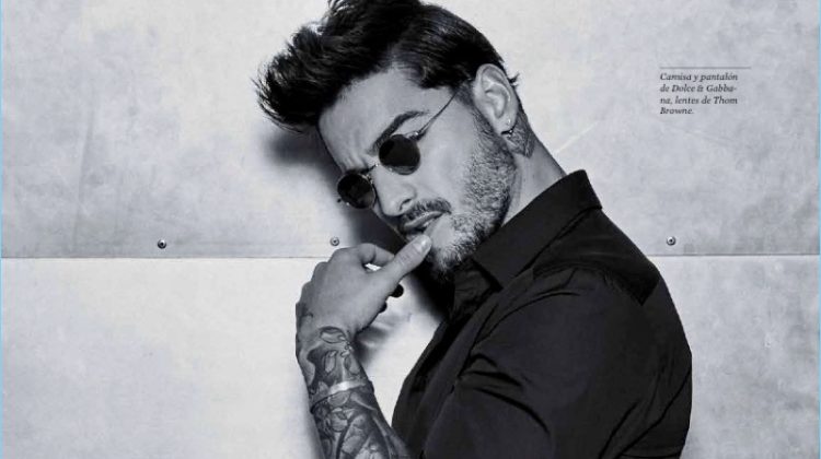 A cool vision, Maluma wears a Dolce & Gabbana shirt and trousers with Thom Browne sunglasses.