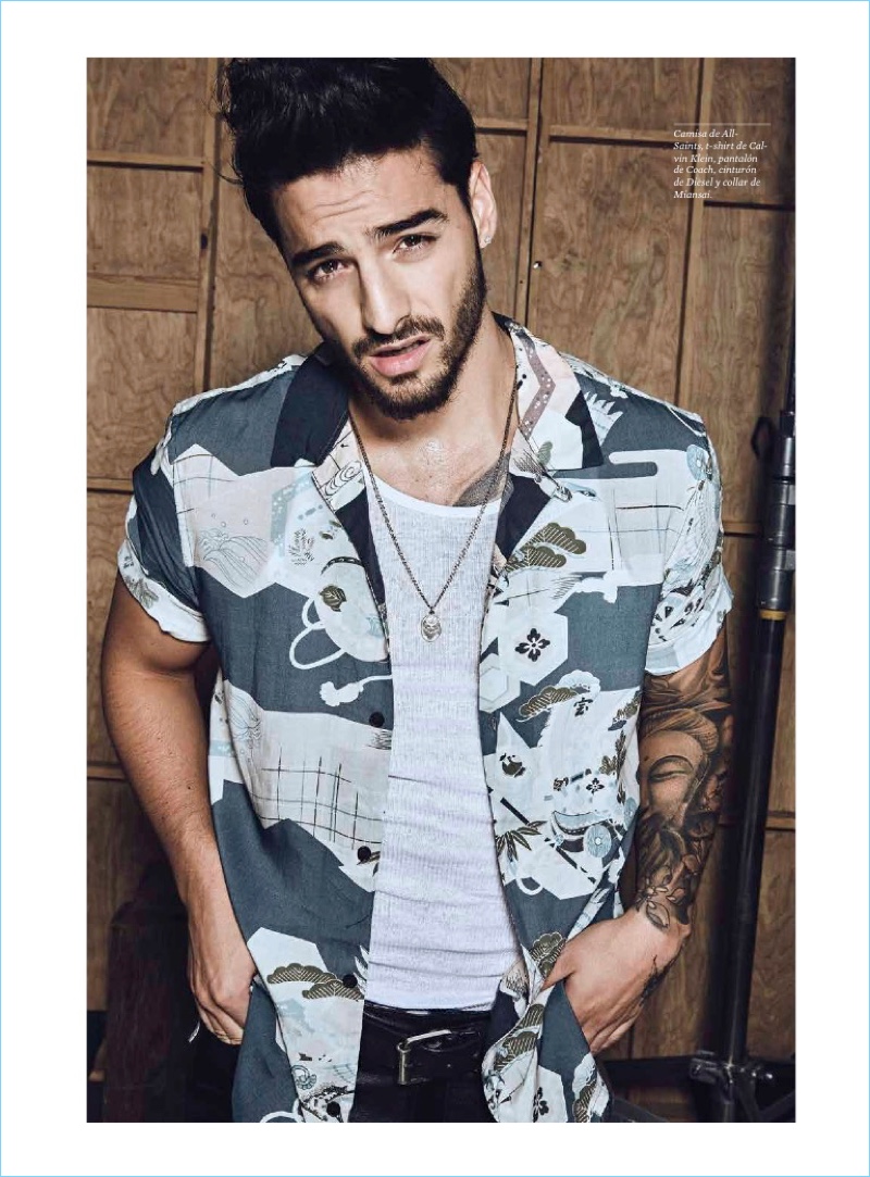 Ready for his close-up, Maluma wears an AllSaints shirt with a Calvin Klein tank and Coach pants.
