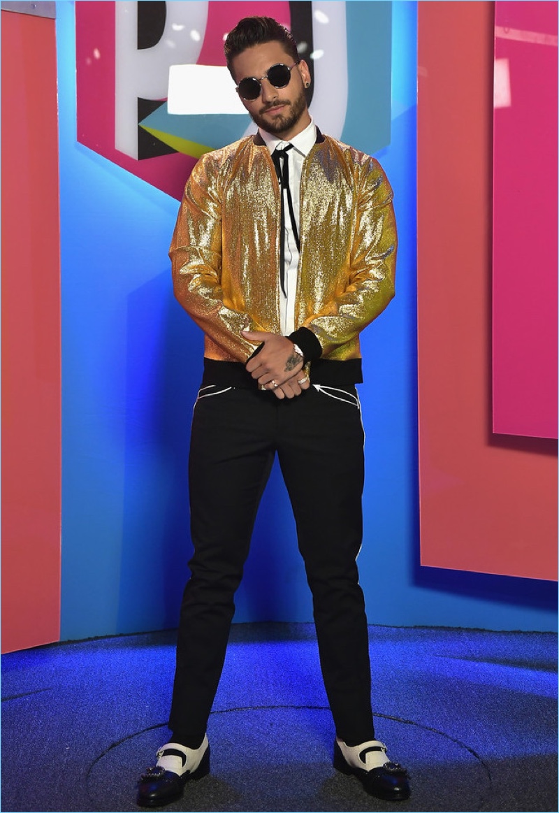 Attending Univision's 2017 Premios Juventud, Maluma makes quite the statement in a gold bomber jacket. He also wears Dolce & Gabbana trousers and Gucci Queercore brogue monk shoes $1,250.