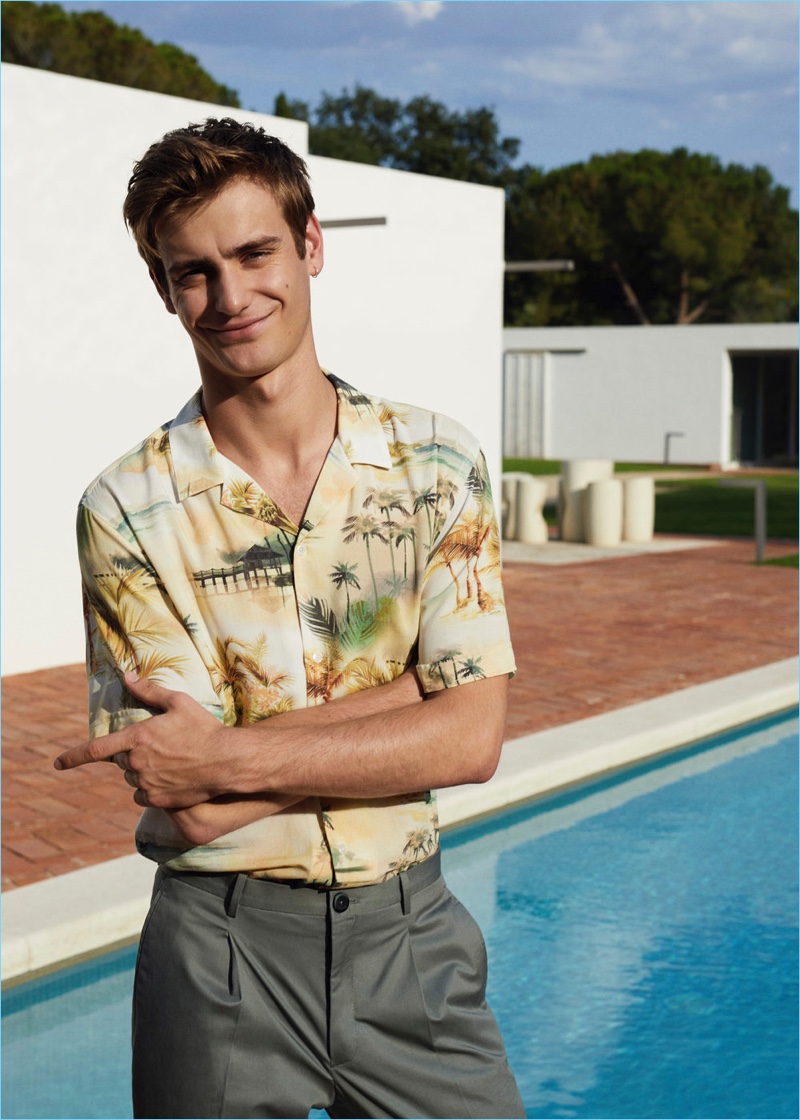 All smiles, Ben Allen wears a summery print shirt from Mango Man.