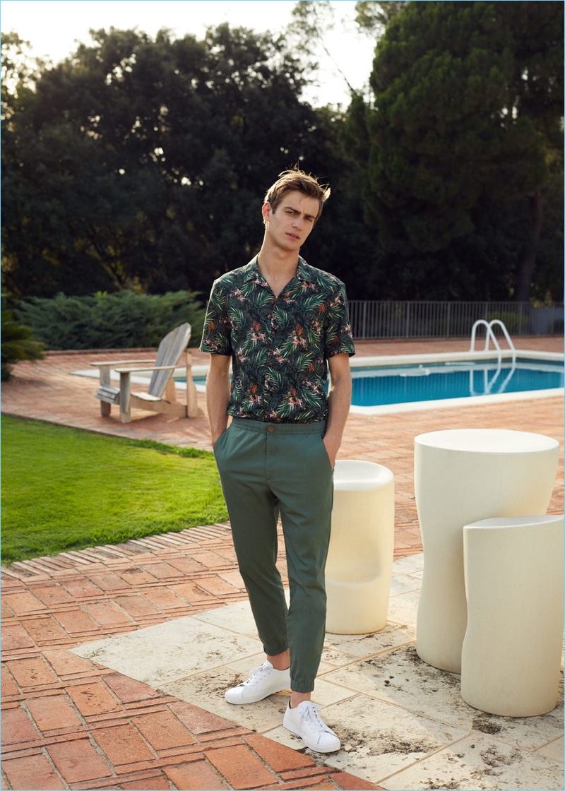 Making a case for green, Ben Allen wears a Hawaiian print shirt and chinos from Mango Man.