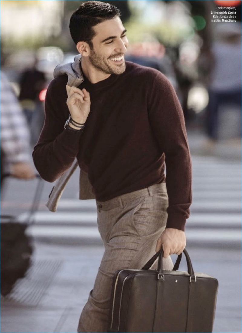 All smiles, Miguel Ángel Silvestre wears an Ermenegildo Zegna look.