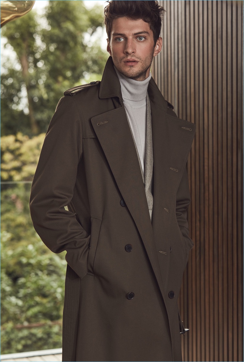 Matthew Bell dons a sleek trench coat from Reiss' fall-winter 2017 collection.