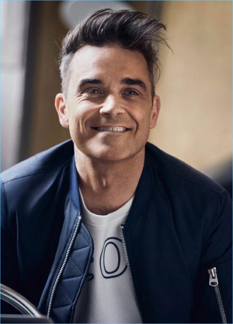 All smiles, Robbie Williams appears in a campaign for his Marc O'Polo collaboration.