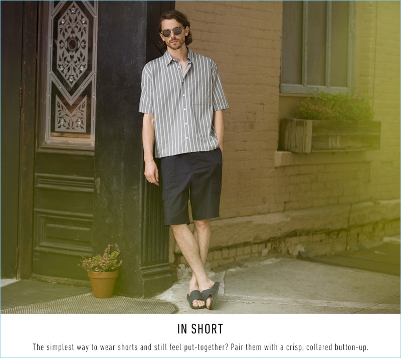 A summer vision, Jeremy Young wears a Vince stripe short-sleeve shirt $225, shorts $285, and slide sandals $95 with Paul Smith sunglasses $310.