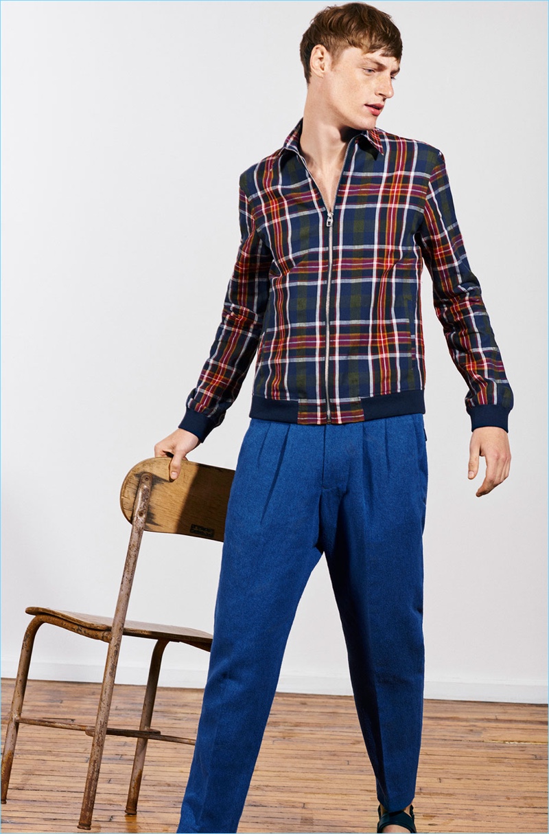 Making a plaid statement, Roberto Sipos wears a shirt jacket with pleated trousers from Zara Man's Studio collection.