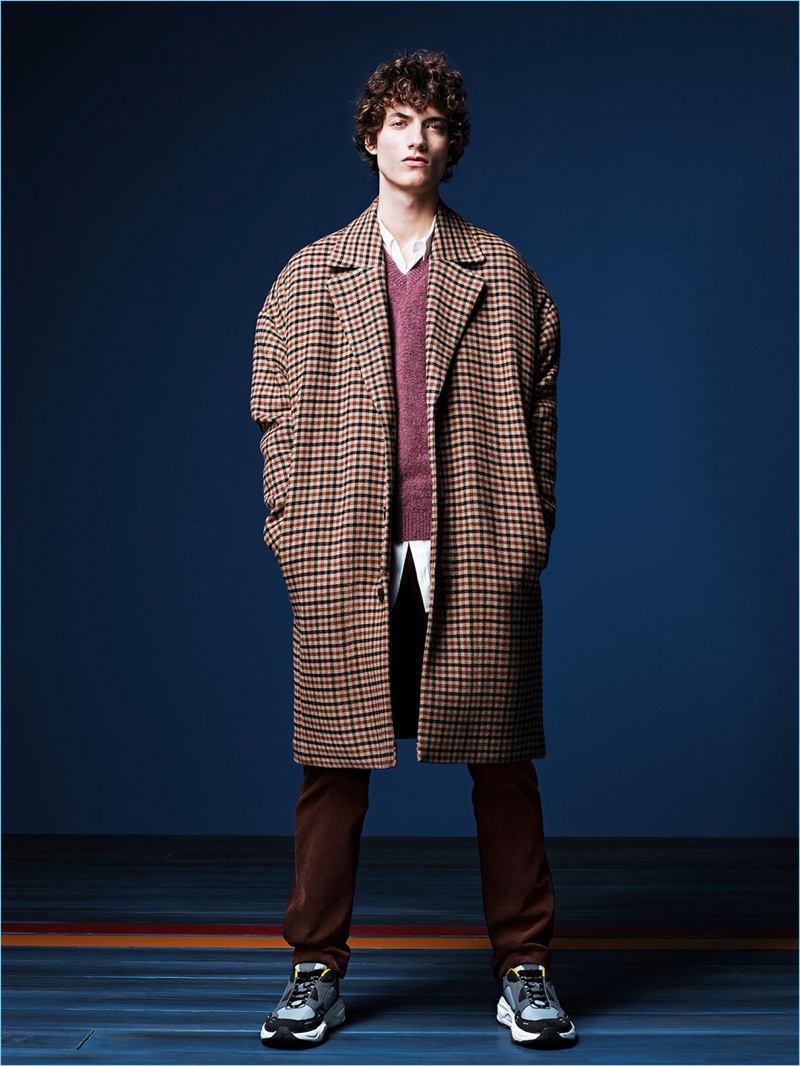 Serge Rigvava rocks a plaid oversize coat for Zara Man's fall-winter 2017 campaign.