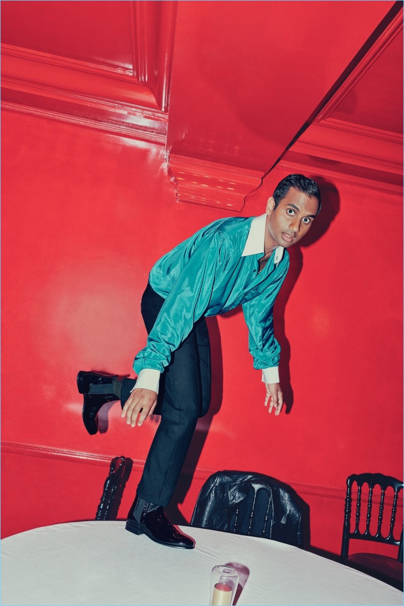 Posing in a red room at Chez Castel, Aziz Ansari wears an Acne Studios shirt with Saint Laurent pants and Pierre Hardy boots.