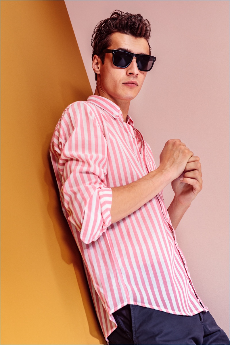 Donning a pink striped shirt, Adrien Sahores fronts Bensimon's spring-summer 2018 campaign.