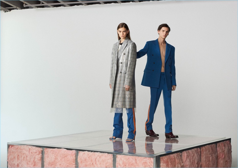 Blue provides a bold color for Calvin Klein 205W39NYC's wool double-breasted sport coat $1,895 and stripe-appliquéd virgin wool trousers $850. Take your look to the next level with Calvin Klein 205W39NYC's Spazzolato leather Chelsea boots $1,095.