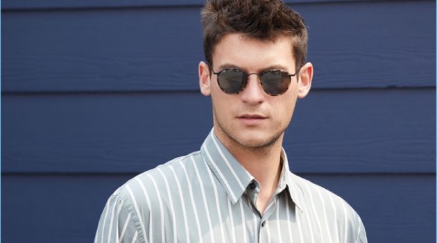 Front and center, Miles Garber wears a Vince striped shirt $225 with A.P.C. pants $275. Oliver Peoples sunglasses $455 and an Uri Minkoff leather pouch $175 complete the look.