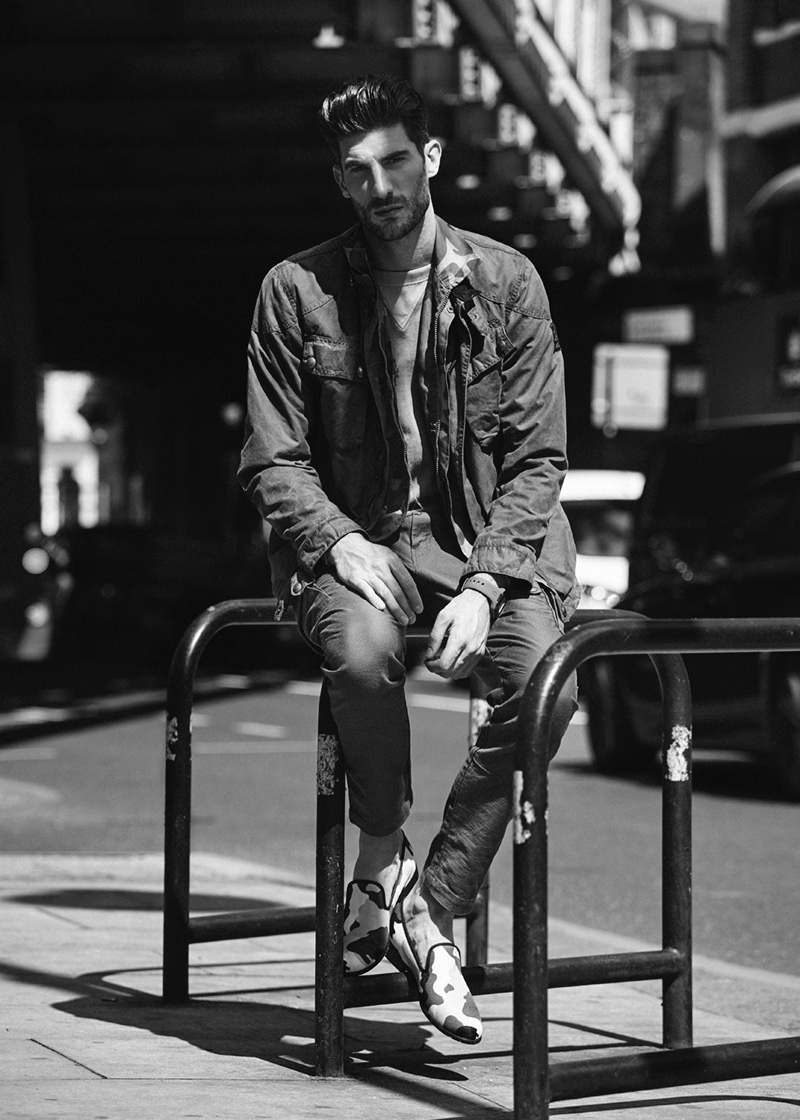 Ryan wears jacket Belstaff, camouflage jacket Spitalfield Market, and sweatshirt Bay Meadows. The British model also dons pants Levi's, camouflage loafers Duke+Dexter, and watch Nixon.