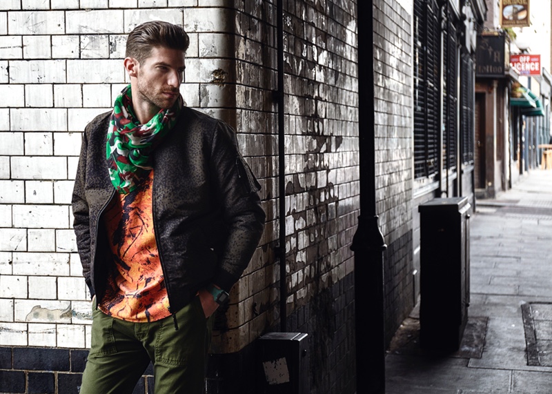 Ryan wears orange sweatshirt Weekday, bomber jacket Levi's, pants Hawksmill, watch Nixon, and vintage scarf.