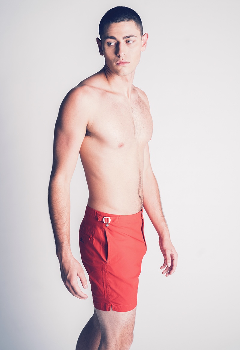 Johnny wears red swim shorts Le Cap.