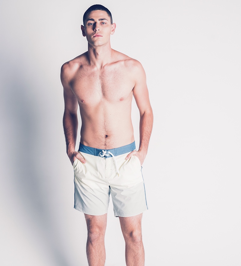 Johnny wears swim shorts Michael Bastian.