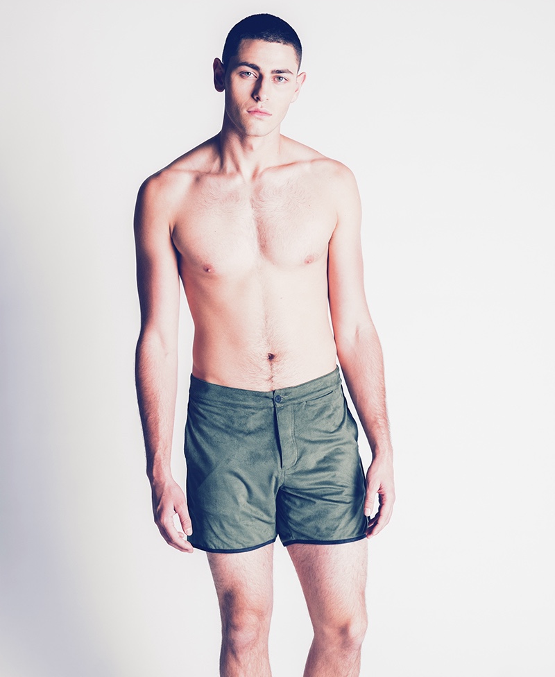 Johnny wears swim shorts Thaddeus O'Neil.