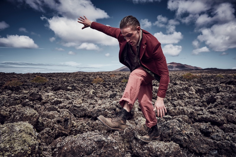 Tom wears blazer Farah, shirt Belstaff, vest Montcler, trousers Bottega Veneta, and boots Weekday.